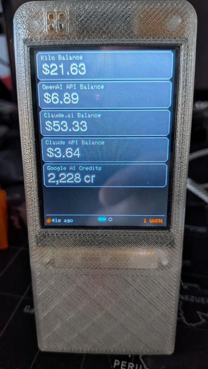 CYD desk display showing AI provider balances